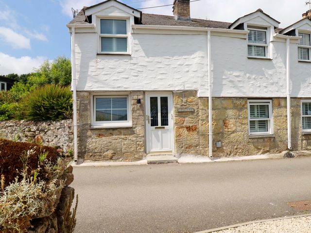 A house exterior with a door and window at Heatherlea Cottage in St. Austell