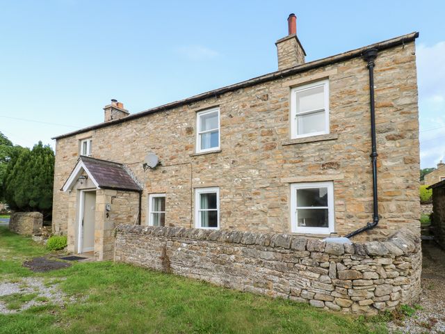 A stone house exterior at Rosemary Cottage in Leyburn