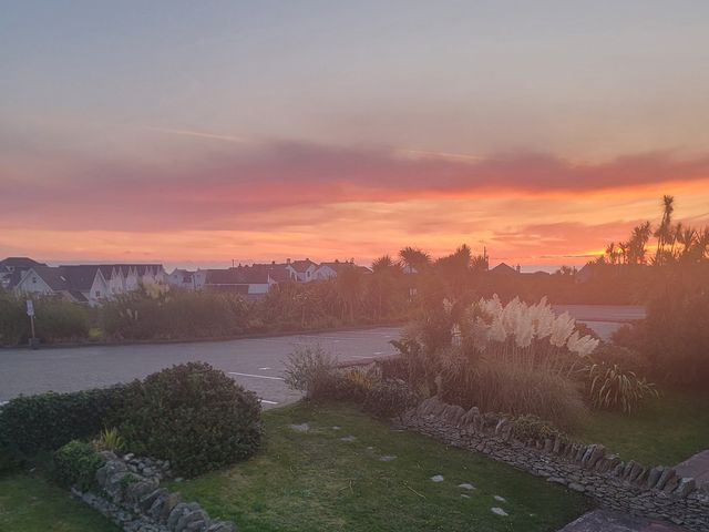 An outdoor view showing houses and plants at Plas Darien no 28 Trearddur Bay