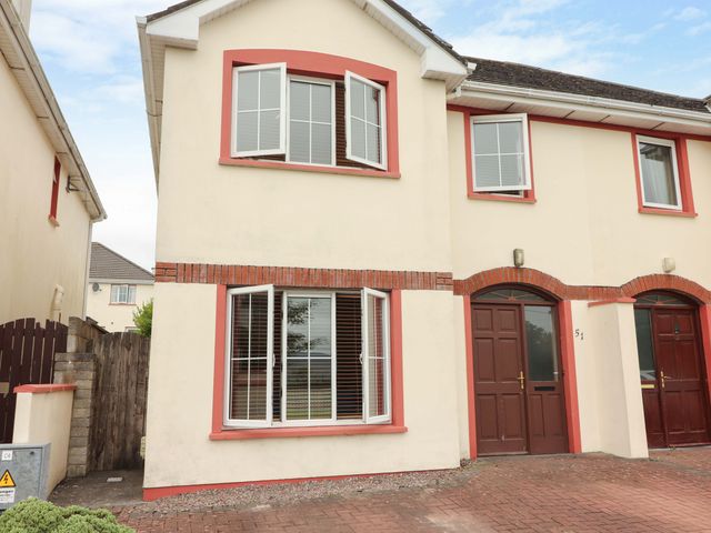 The exterior of a house with doors and windows at 51 Woodview Park in Tralee, County Kerry