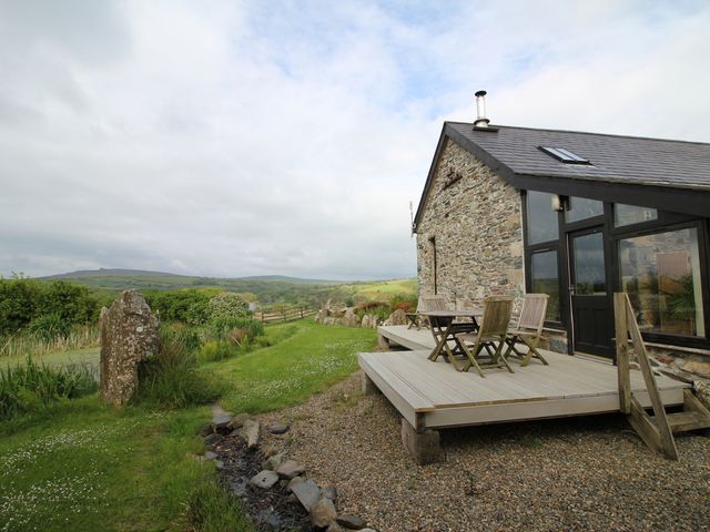 An outdoor area with decking and seating at The Dovecote in Fishguard