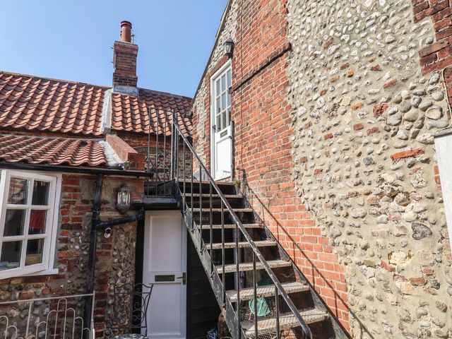 An outdoor staircase leading to a door at The Plover in Blakeney, Norfolk
