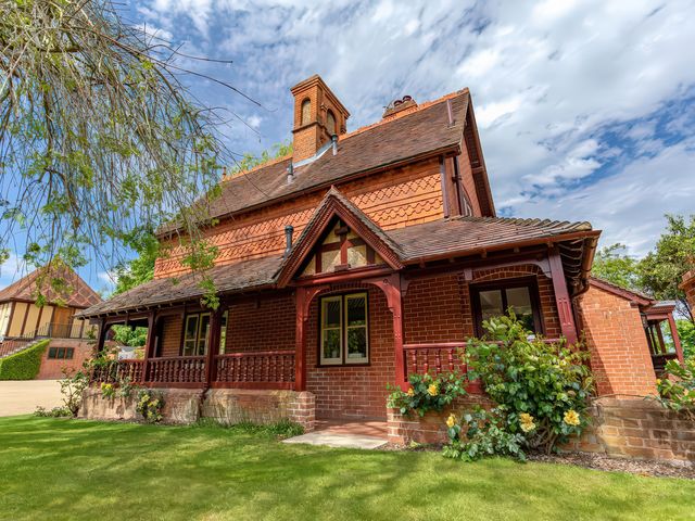 A house with a porch and garden at Dairy Cottage Waddeston