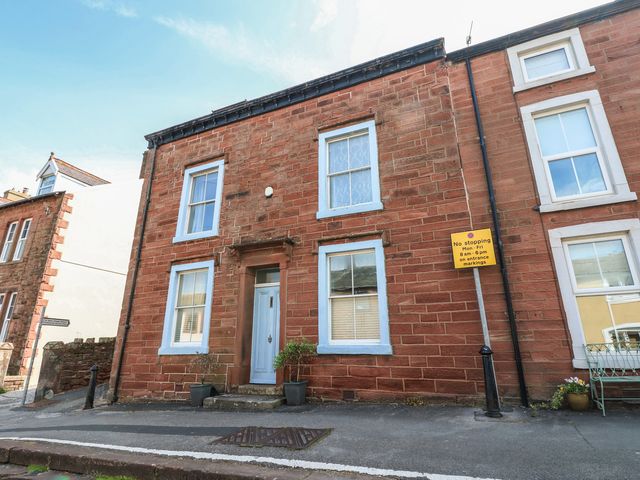 A building with windows and a door at Hampton House in St. Bees