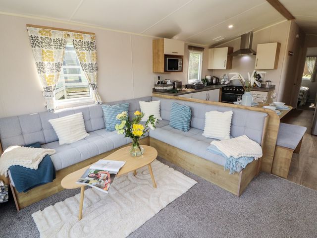 A living room with a sofa and coffee table at Barnes Retreat in Carnforth