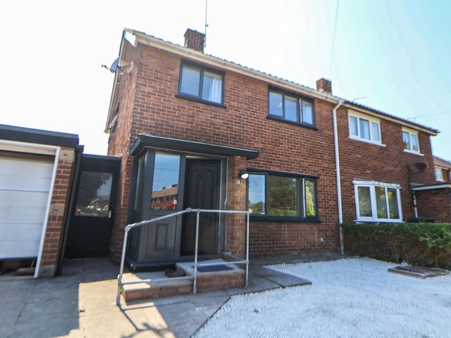 A house with a front door and pathway at 11 Coniston Road Chester