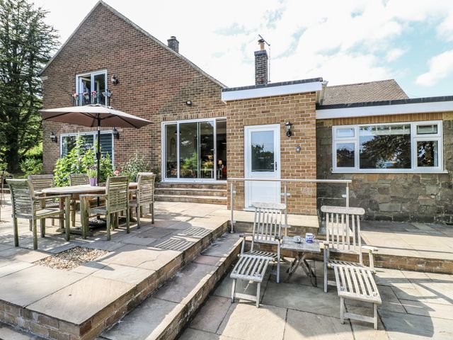 An outdoor area with a table and chairs at The View @ Orchard View in Hognaston