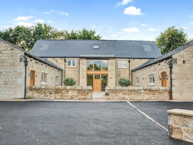 A building with a front door and windows at Alston House in Longridge