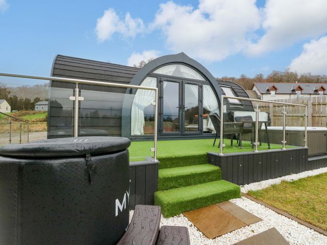 An outdoor area with steps and a hot tub at Crofters Suite