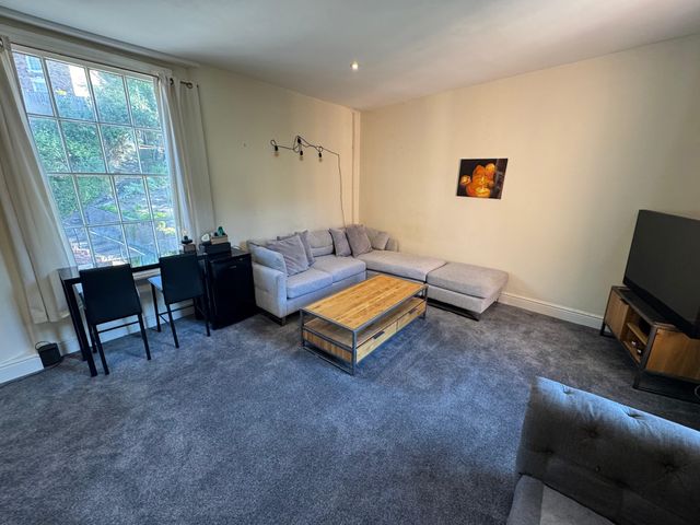A living room with a sofa and coffee table at 31 High Street in Telford