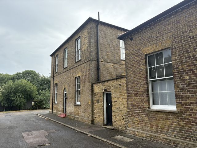 An exterior view of a building with windows and a door at Woolwich Apartment in Woolwich