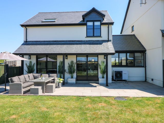 An outdoor seating area with a sofa and table at Just A Cottage in St Florence