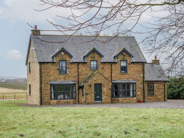 A house with windows and a door at Hollymoor Hall Farm in Richmond