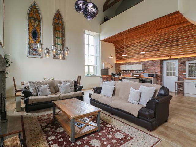 A living room with sofas and a coffee table at The Old Chapel in Norham