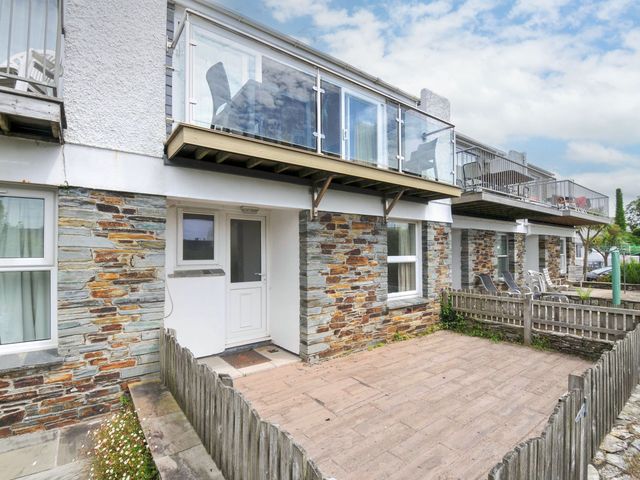 An outdoor area with a patio and entrance at 9 Slipway Cottages Rock