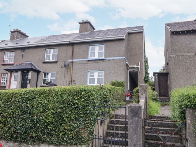 A house with a hedge and steps at Burna Letterkenny