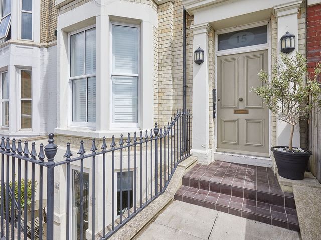 An entrance with a front door and gate at Apartment 2 in Whitby