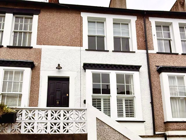 A house with a front door and windows in Conwy