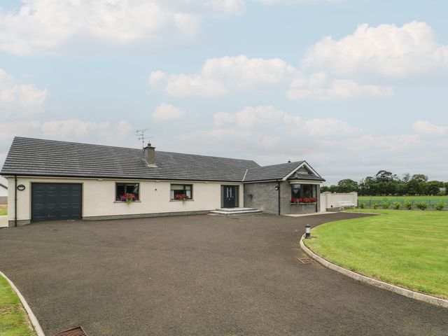A house with a garage and flower boxes at Clarmes House in Limavady