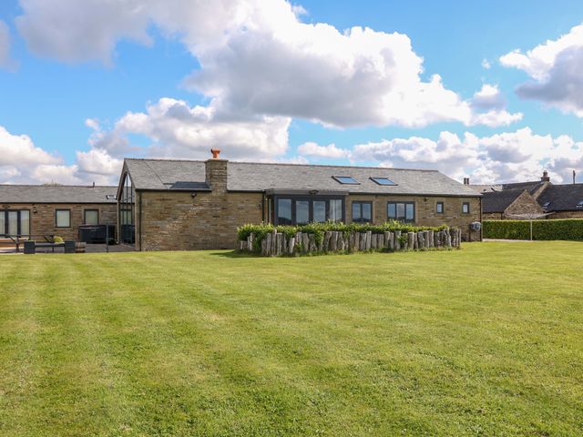 A house with a garden and grass at Highgate house in Holmesfield near Dronfield
