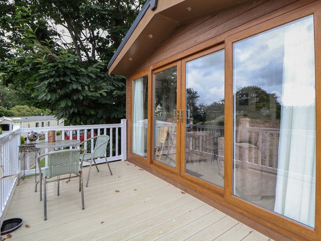 A deck with a table and chairs at 96 Ruthin