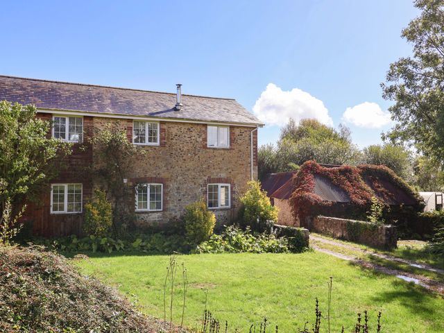 A house with windows and a garden at The Cottage Middle Westwater Westwater Nr Axminster