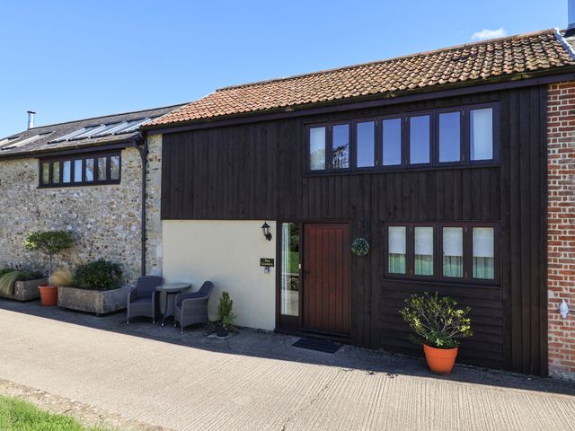 An exterior view of a house with a garden area at The Granary Wyke Nr Axminster