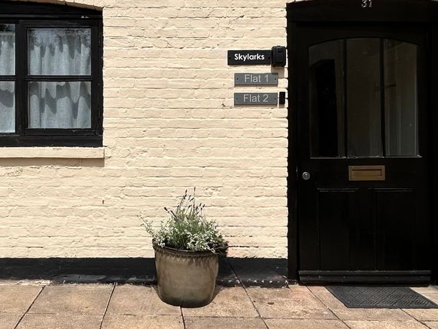 An entrance with a window and door labeled Skylarks in Winchester