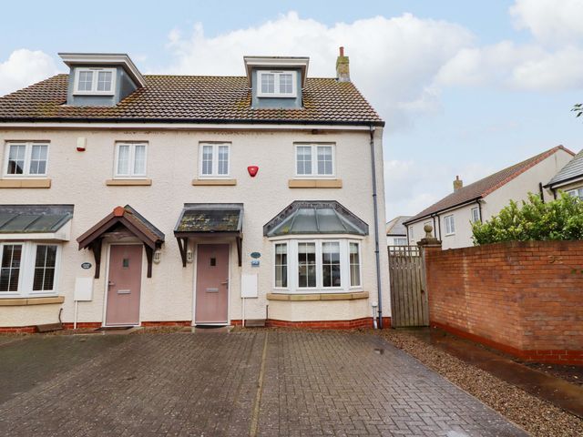 A house exterior with doors and windows at High Sea View