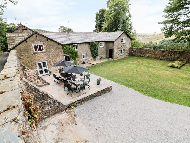 An outdoor area with a table and chairs at The Bothy Wildboarclough