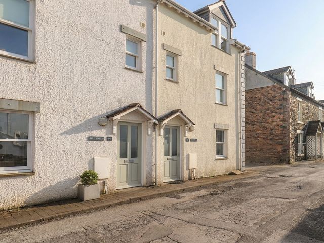 A facade of two houses with doors and windows at Swirl Howe in Keswick
