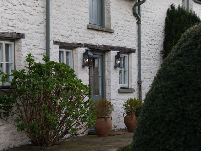An outdoor view of a house with a door and windows at Gatekeepers Cottage Myddfai near Llandovery