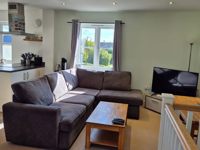 A living room with a sofa and coffee table at 54 swallow road