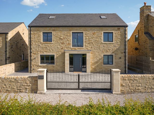A house with a gate in front at Northstone House Blackburn