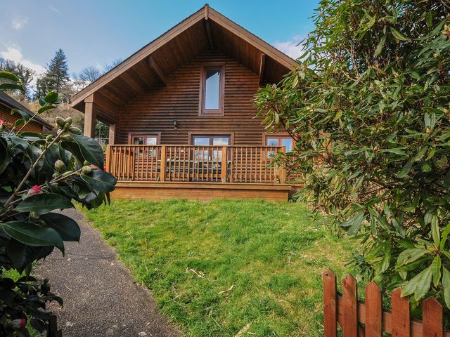 A log cabin with decking and grass at Eden in St Breward