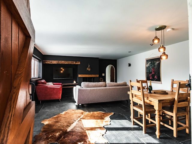 A living room with a sofa and dining area at New House Barn in Bradley near Ashbourne