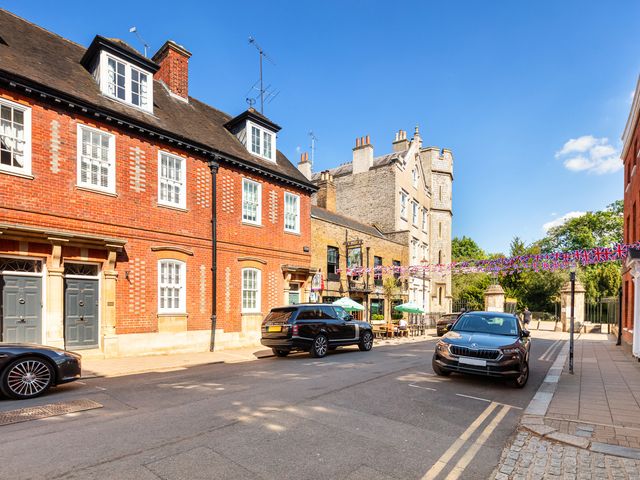A street with buildings and parked cars at Castle View in Windsor, Berkshire