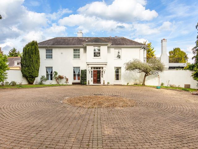A house with a driveway and garden at Violet House in Iver
