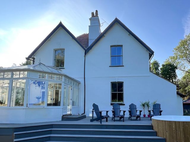 An outdoor area with a conservatory and seating at Your Country House in Reading