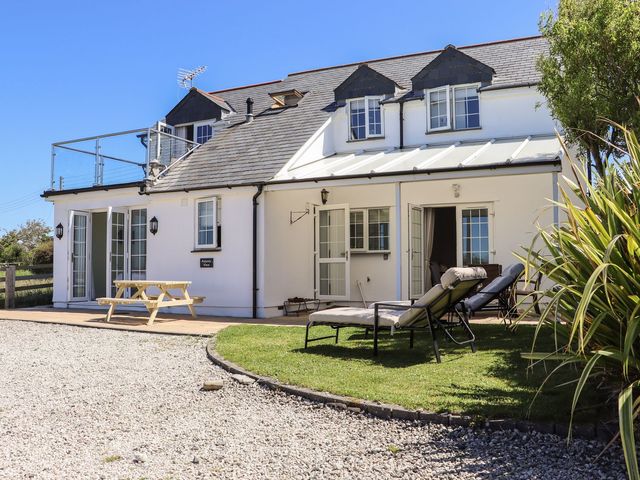 An outdoor area with seating and greenery at Atlantic View (3 bed) Bude