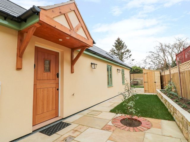 A front yard with a door and light fixtures at The Old Sorting Office in 