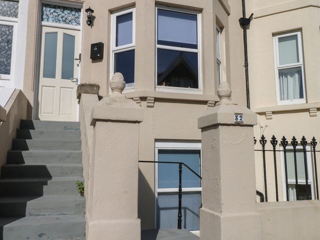 An entrance with a door and steps at Pebbles in Eastbourne