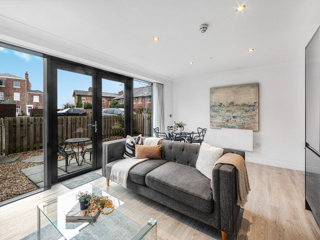 A living room with a sofa and a coffee table at Eastgate Suite in Chester