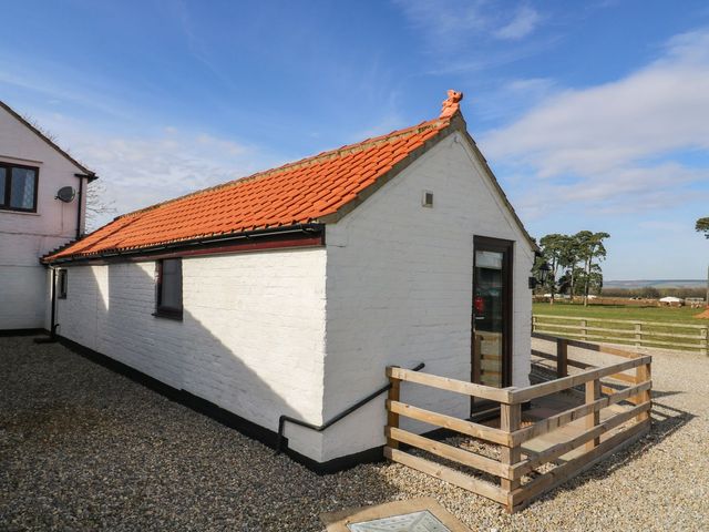A house with a red roof and gravel surface at 1 Small in Malton