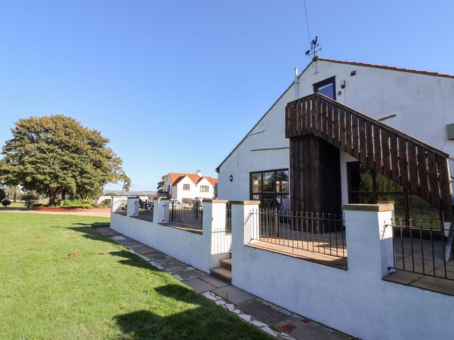 A house with a staircase and railing at East Cottage in East Knapton near Rillington