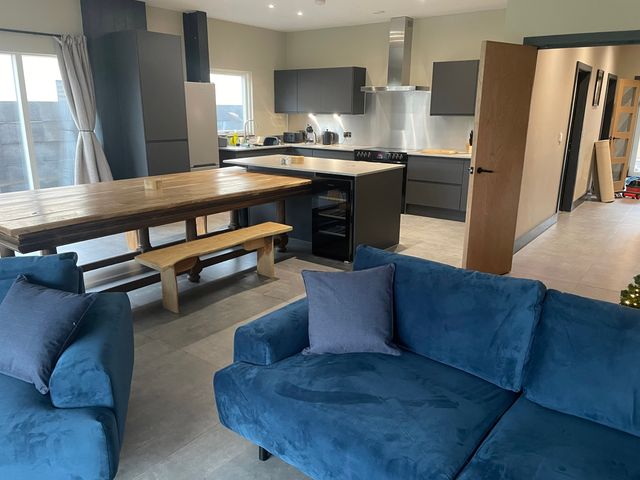 A kitchen with a dining table and chairs at Spring Meadow in Croxdale
