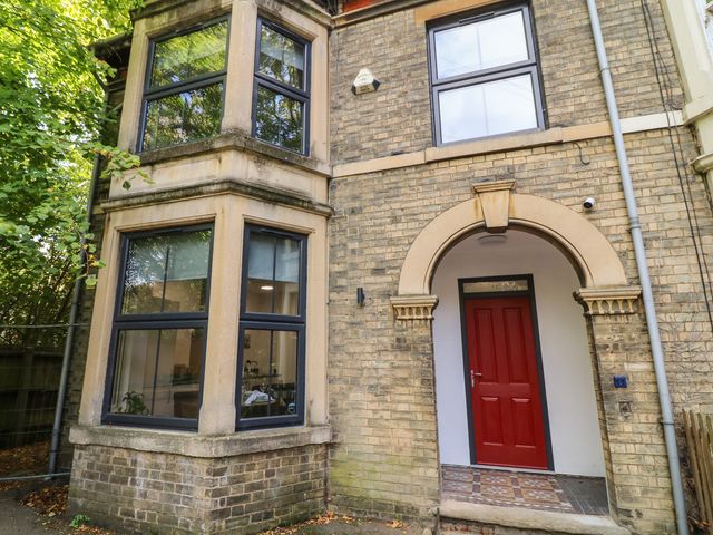 A red door with archway and windows at 2 in Peterborough