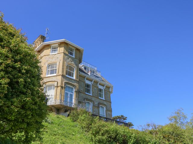 A house with a balcony and multiple windows at 6 Priory in Shanklin