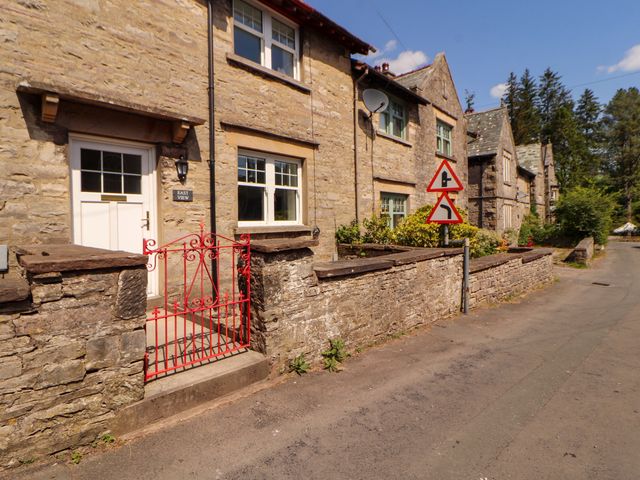 A house exterior with a red gate at East View Kirkby Stephen
