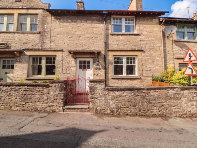 A stone house with a front door and windows at East View in Ravenstonedale near Kirkby Stephen